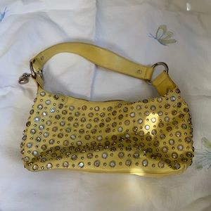 Yellow studded purse